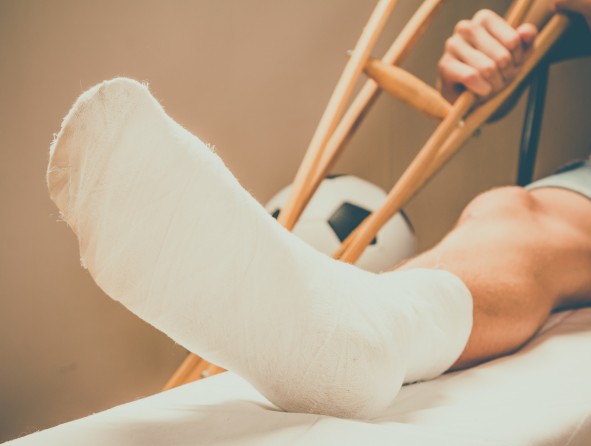 Soccer football player and sport plaster foot leg,  treatment.